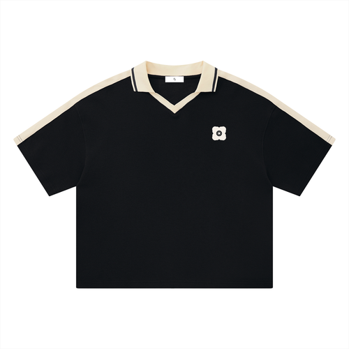 Courtside Polo — Black with cream trim, front view.